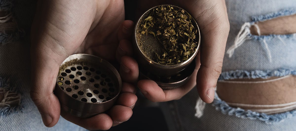 rolling weed with a grinder. blunt vs joint. buy weed online in Ajax cannabis dispensary.