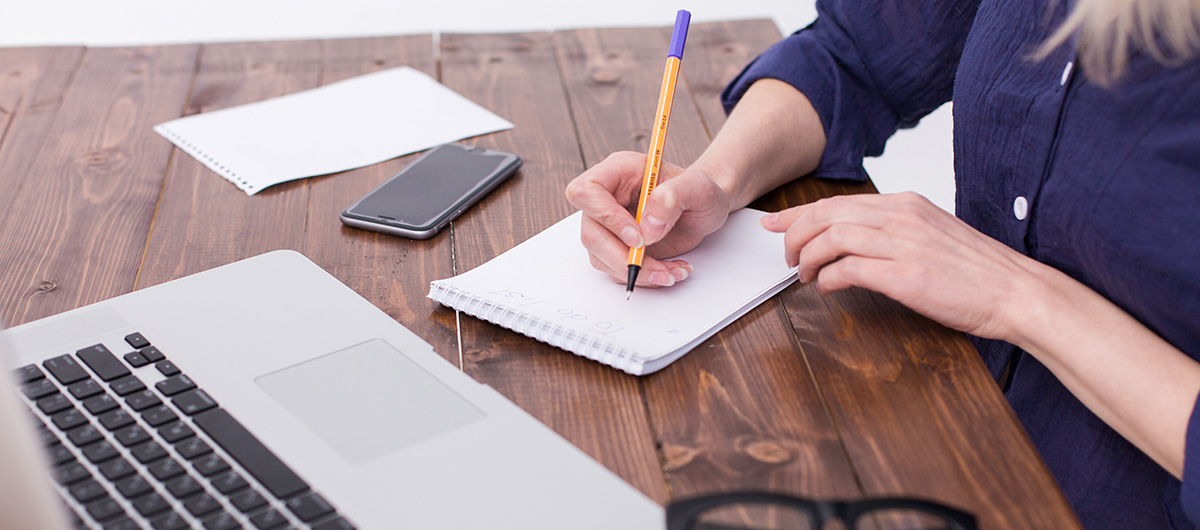 Wondering How to Get Higher on Less Weed? 6 woman working on laptop with a note pad. the 6ix Cannabis dispensary and pot shop.