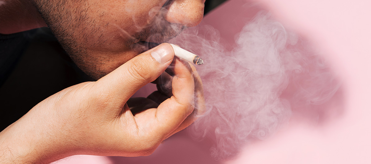 man smoking a joint in Ajax, Ontario. Cannabis dispensary Ajax & Whitby.