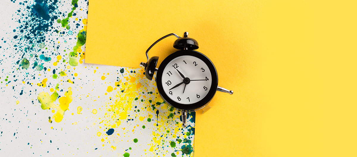 Vintage alarm clock on colourful background. weed delivery Ajax Ontario.