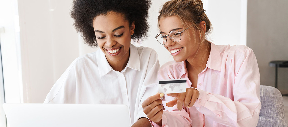 Two woman shopping online to buy weed from a legal pot shop in Ajax Ontario. 