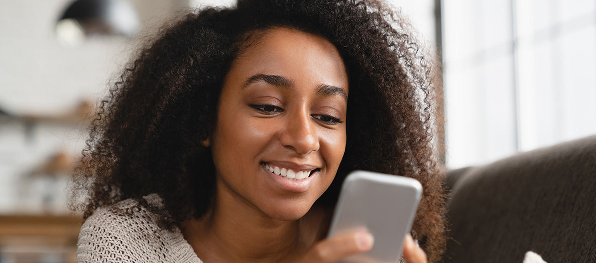 10 Facts You Need To Know About Pre-Rolled Joints 7 girl relaxing at home using smart phone browsing