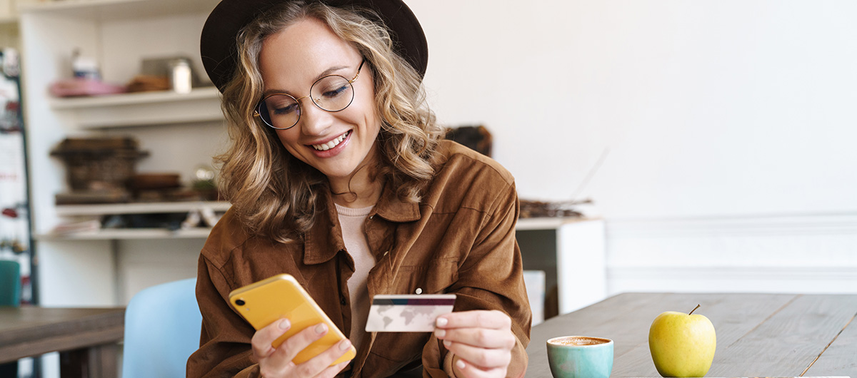 10 Facts You Need to Know About Vapes, Vape Carts, & Vape Pens 43 smiling woman in hat using cellphone to shop