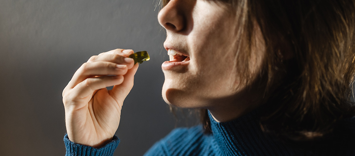 Woman trying THC edibles and gummies from Ajax cannabis dispensary and pot store with weed delivery The 6ix Cannabis.